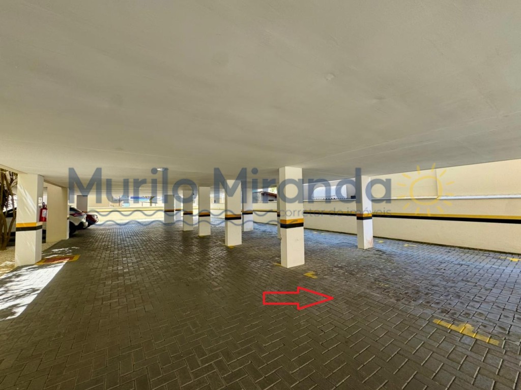 Vaga de garagem indicada na seta vermelha